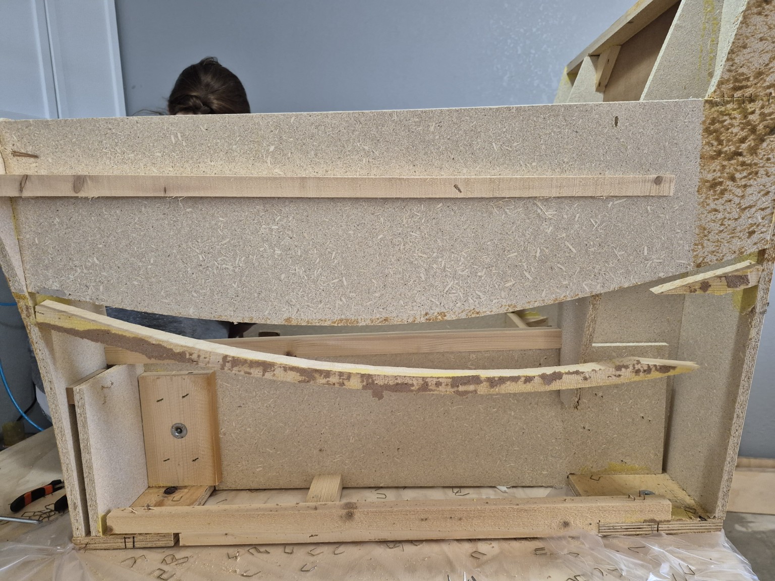 Original side assembly with a broken rail hanging away from the board