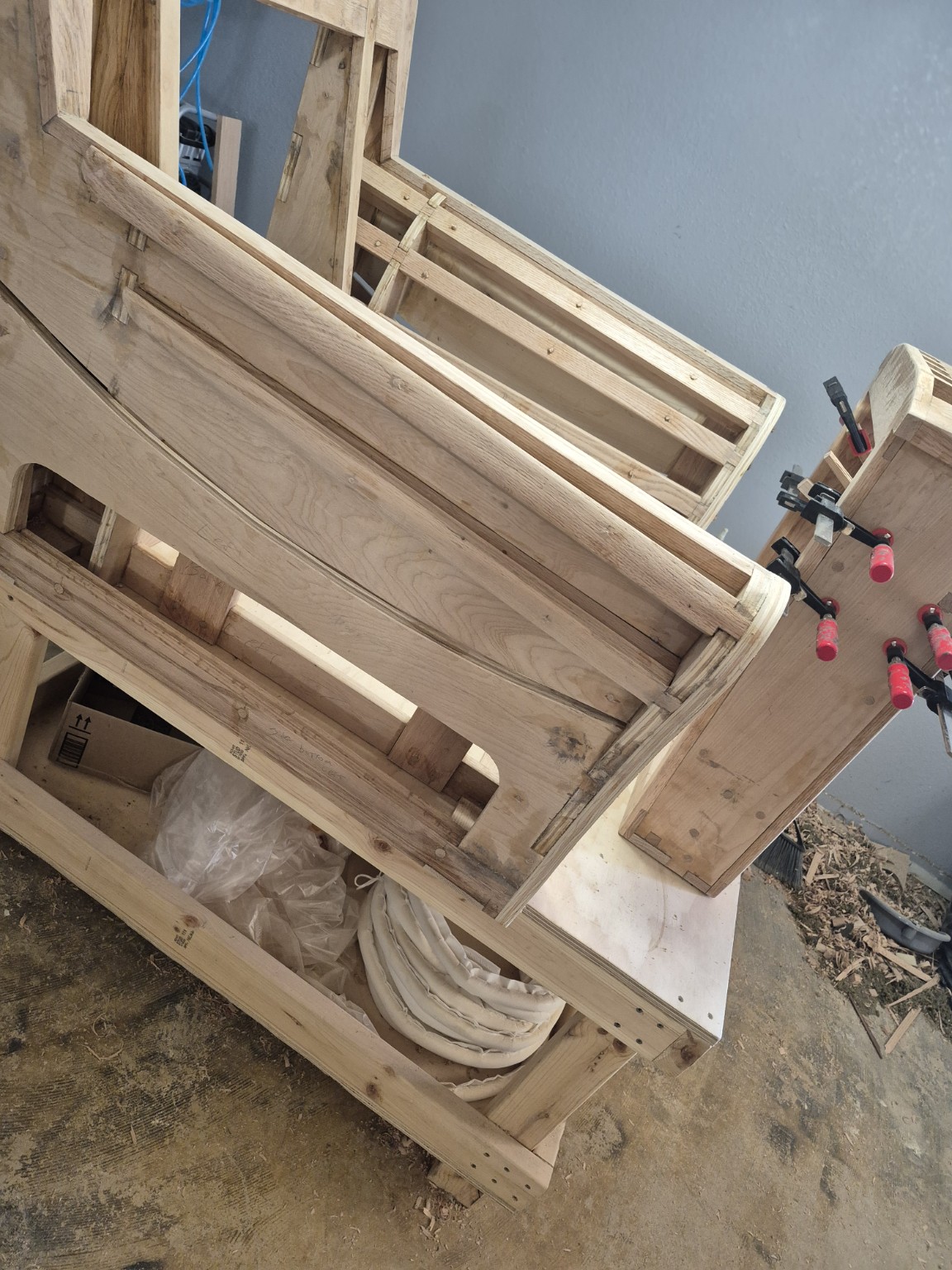 Rear view of the wooden frame showing rails and fitted upright members