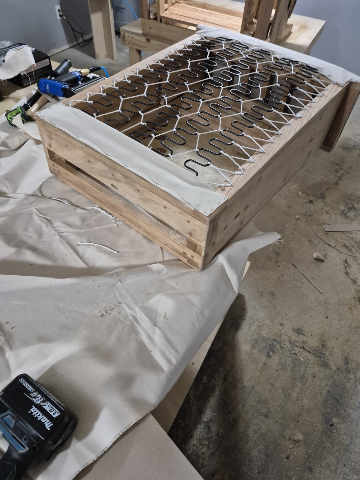 Separate wooden seat assembly with sinuous springs and connecting cord